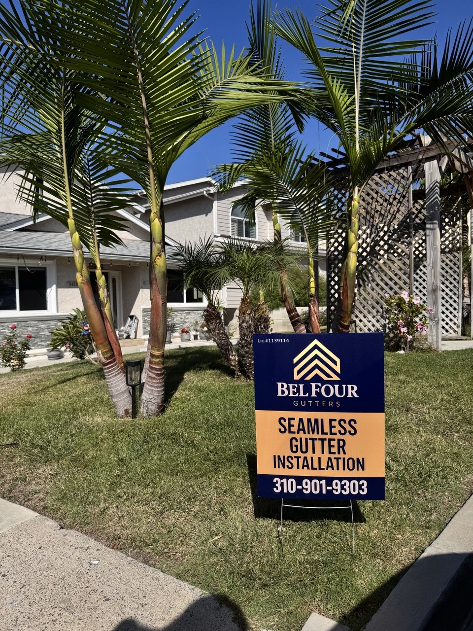 BelFour Gutters yard sign at customer home in Southern California — seamless gutter installation 310-901-9303